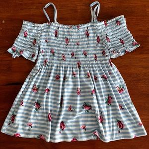 ‘No Boundaries’ off the shoulder flowy shirt. Blue and white striped with roses.